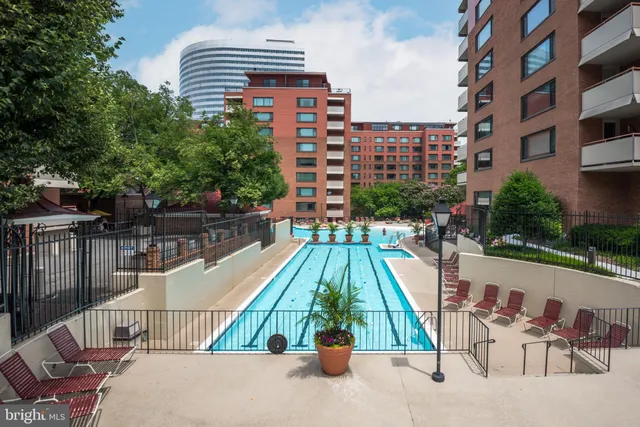 a view of a swimming pool with a lounge chairs