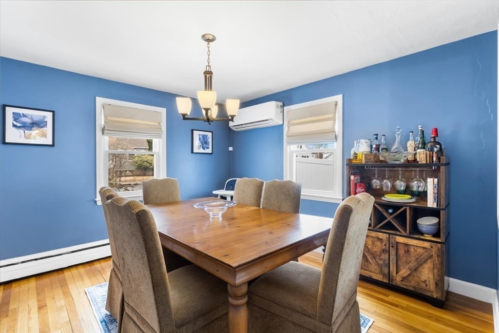 10 Earnshaw Street Boston, MA 02132 - Photo 11 of 35 a view of a dining room with furniture window and wooden floor
