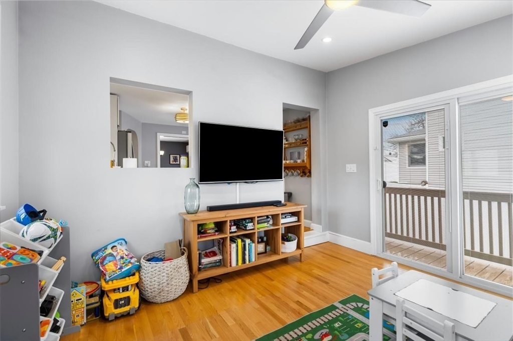 10 Earnshaw Street Boston, MA 02132 - Photo 13 of 35 a living room with furniture and a flat screen tv