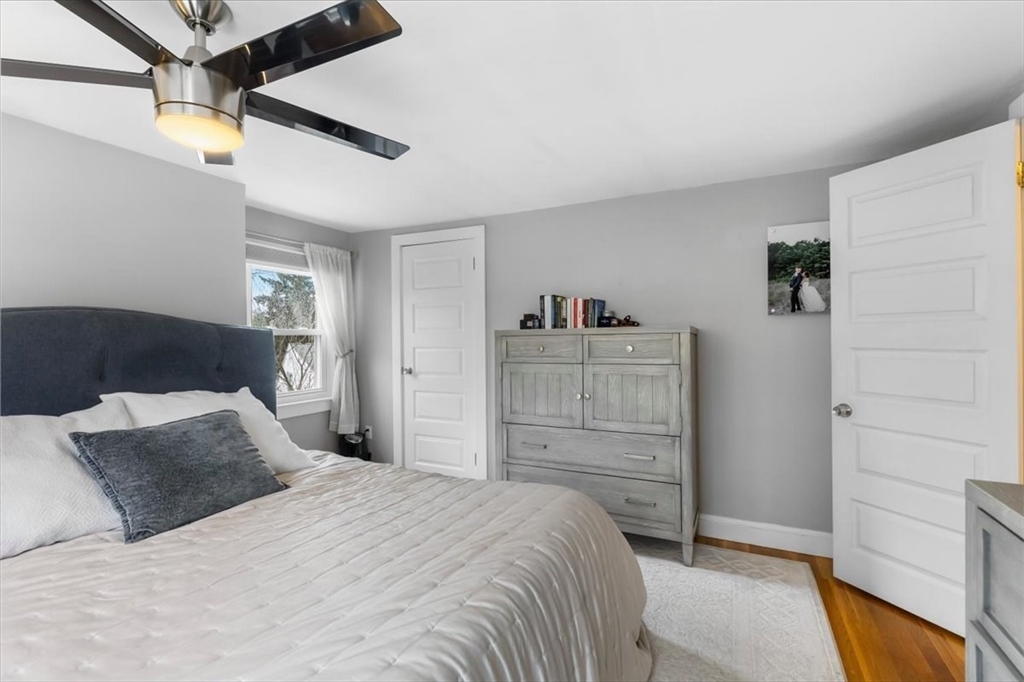 10 Earnshaw Street Boston, MA 02132 - Photo 20 of 35 a bedroom with a bed and a cabinets