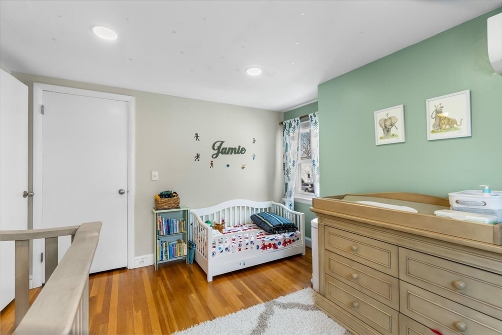 10 Earnshaw Street Boston, MA 02132 - Photo 23 of 35 a bedroom with a bed and a table