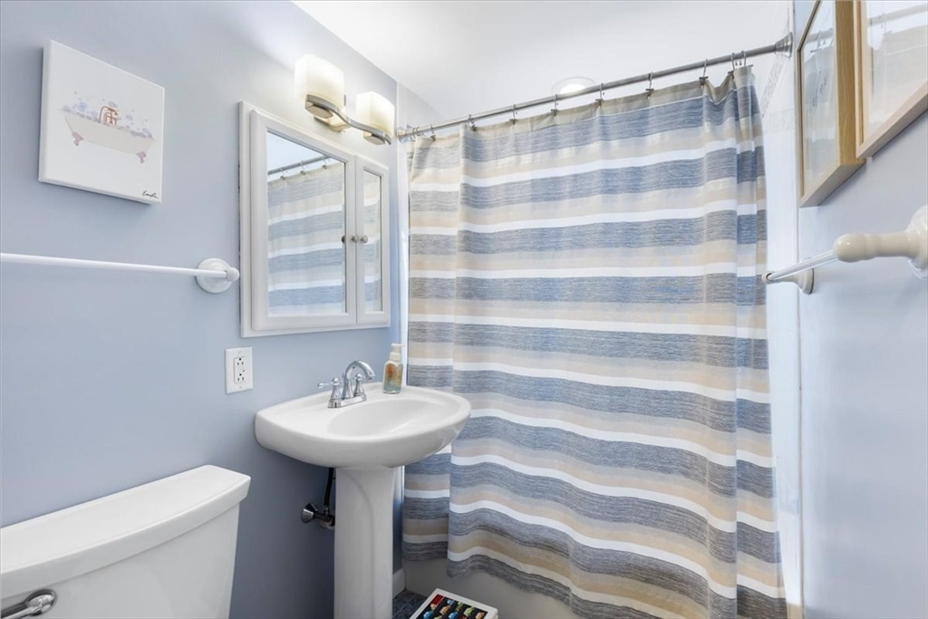 10 Earnshaw Street Boston, MA 02132 - Photo 24 of 35 a bathroom with a sink toilet