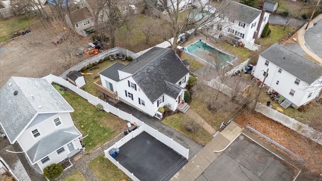 10 Earnshaw Street Boston, MA 02132 - Photo 33 of 35 an aerial view of a house with a yard