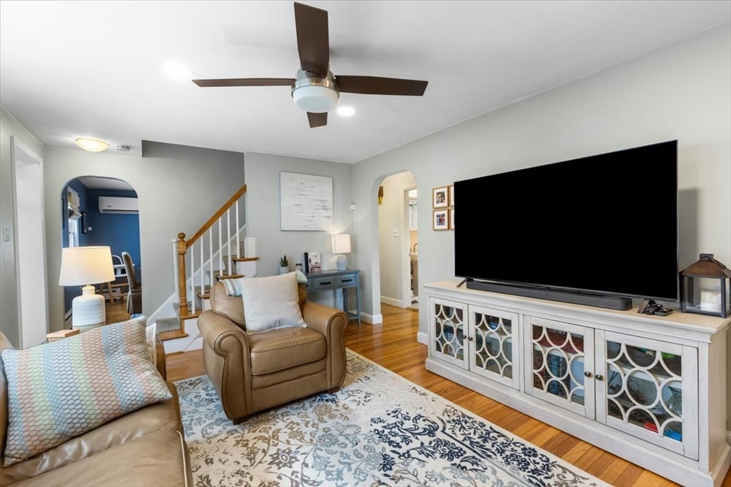 10 Earnshaw Street Boston, MA 02132 - Photo 6 of 35 a living room with furniture and a flat screen tv