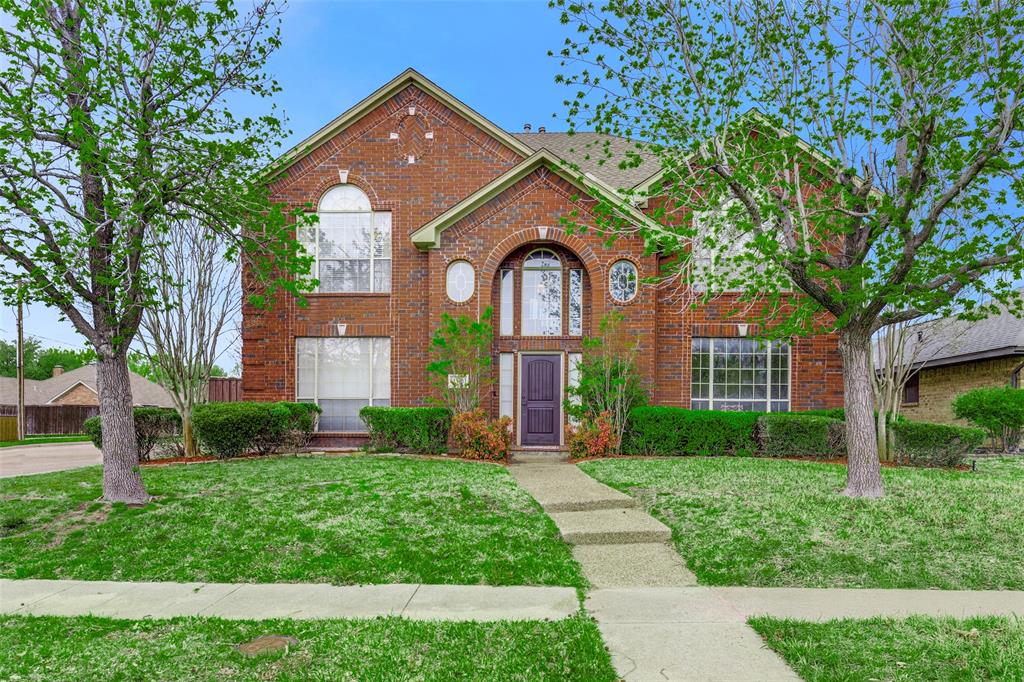 2101 Whitehurst Lane Carrollton, TX 75007 - Photo 1 of 1 View of front facade featuring brick siding and a front lawn