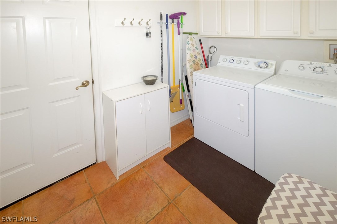 12882 Timber Ridge Drive Fort Myers, FL 33913 - Photo 21 of 25 a utility room with dryer and washer