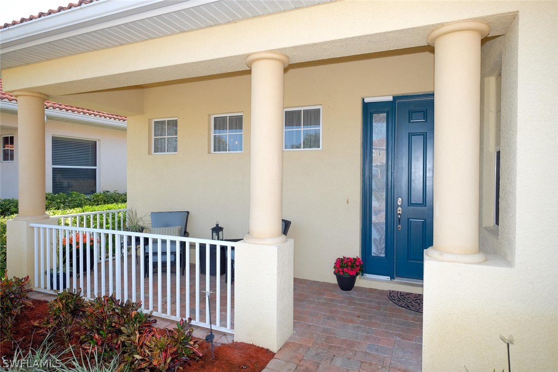 12882 Timber Ridge Drive Fort Myers, FL 33913 - Photo 3 of 25 a view of a house with a yard