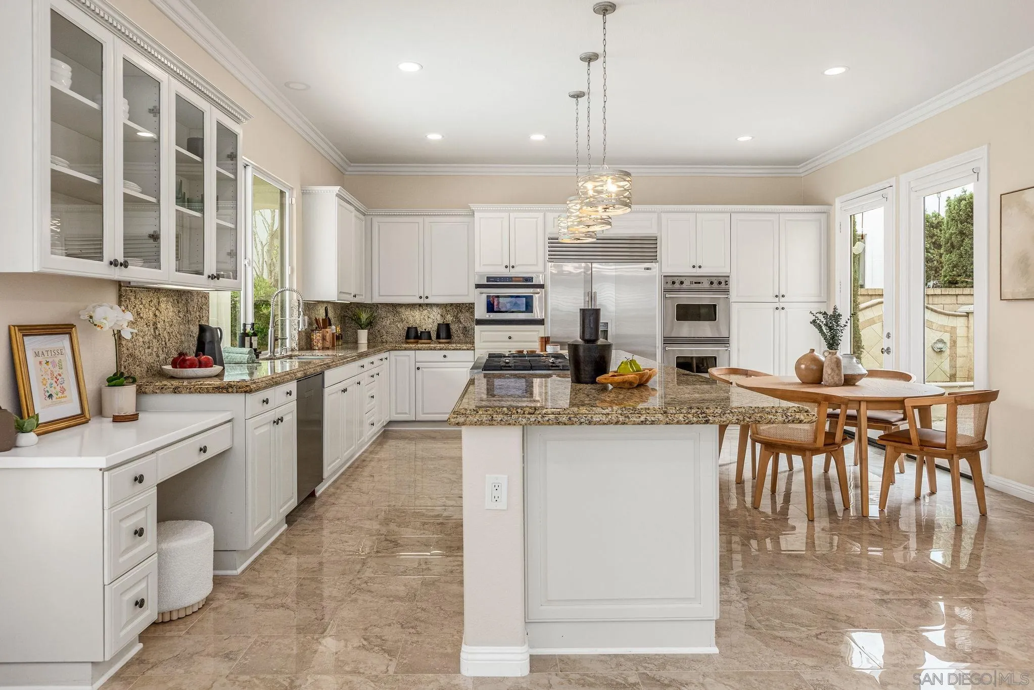 5582 Valerio Trail San Diego, CA 92130 - Photo 11 of 43 a kitchen with counter top space appliances and cabinets