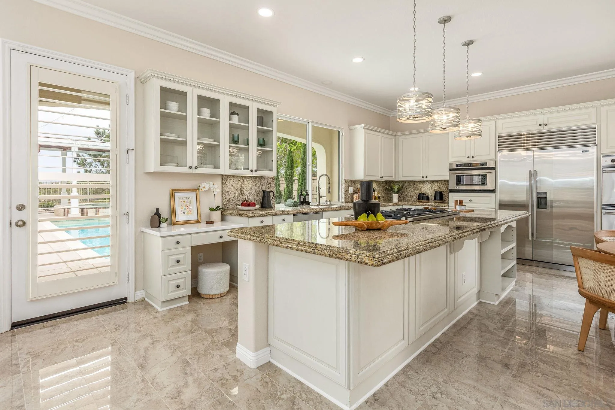 5582 Valerio Trail San Diego, CA 92130 - Photo 13 of 43 a kitchen with stainless steel appliances granite countertop a stove a sink and a refrigerator