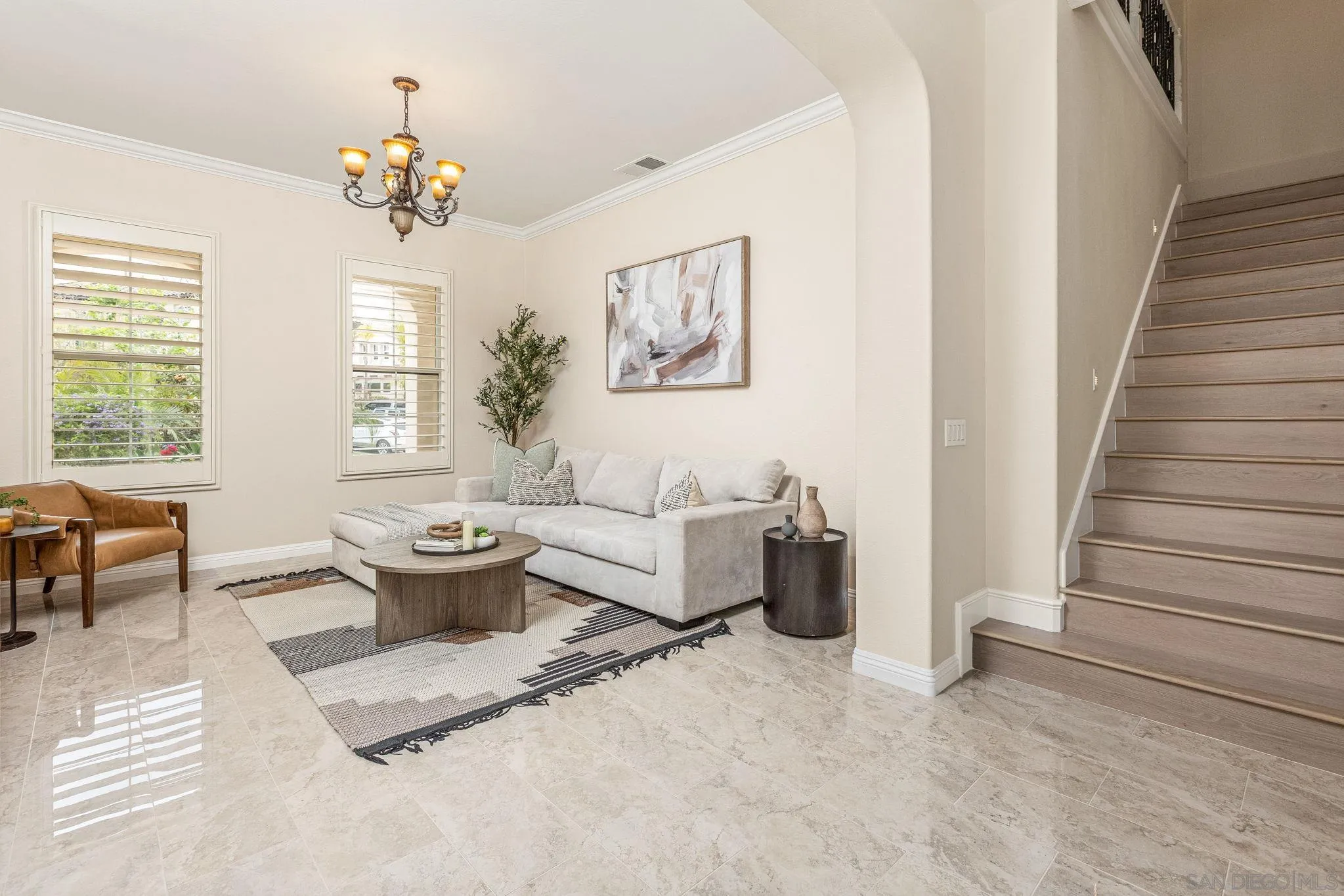 5582 Valerio Trail San Diego, CA 92130 - Photo 16 of 43 a living room with furniture and a dining room