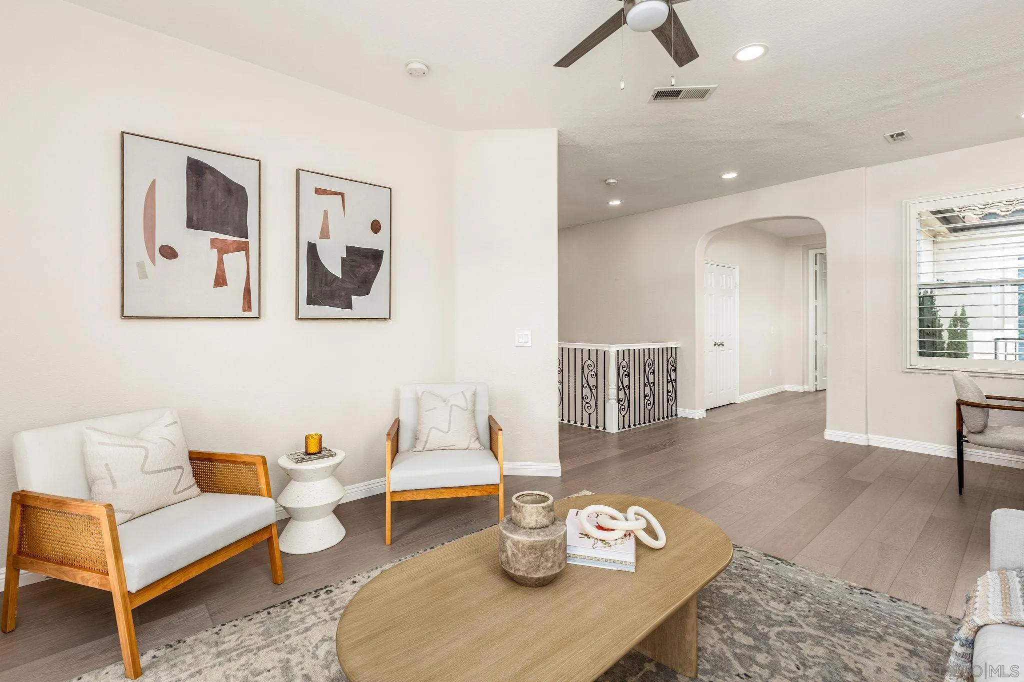 5582 Valerio Trail San Diego, CA 92130 - Photo 19 of 43 a living room with furniture and wooden floor