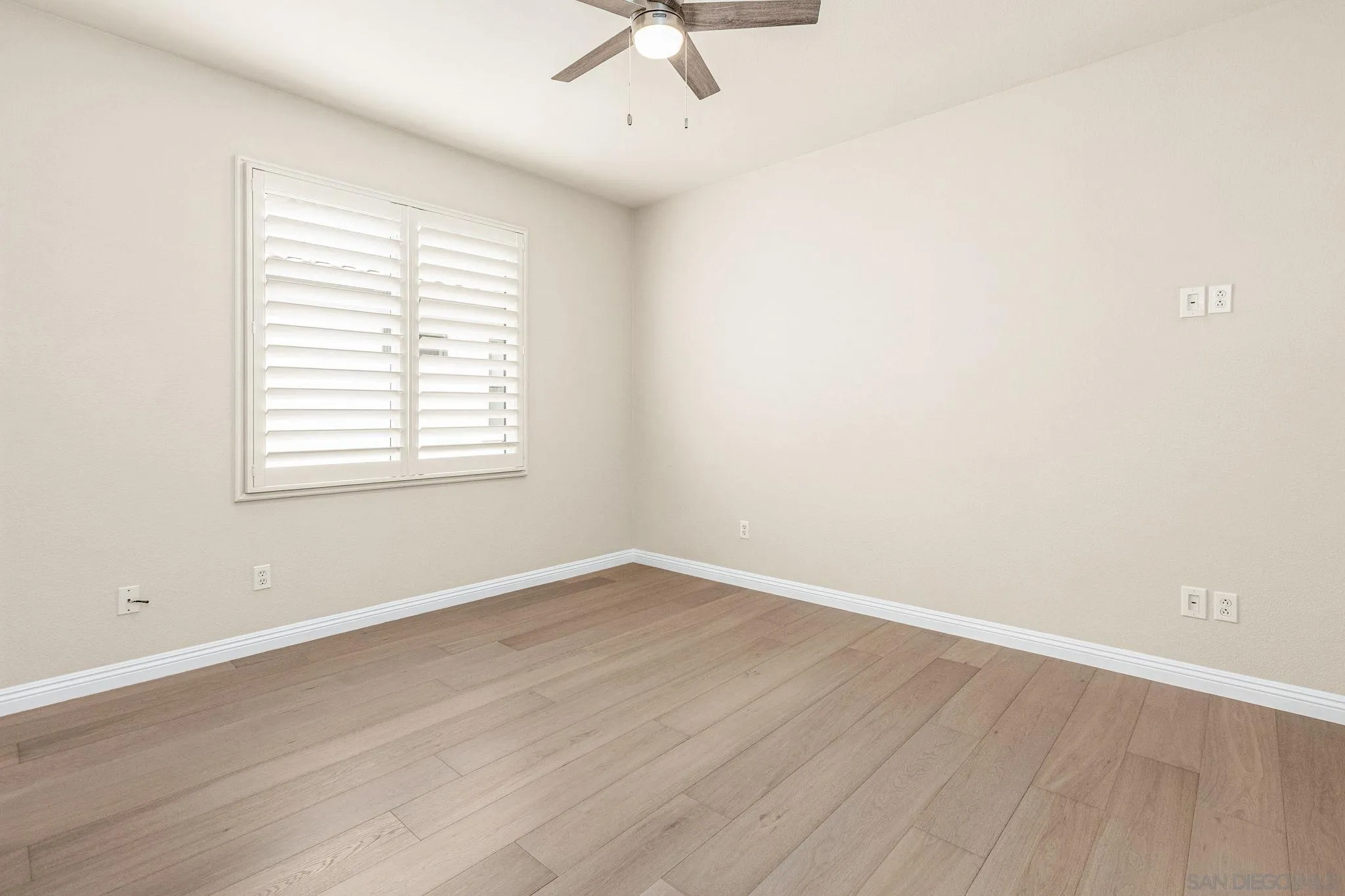 5582 Valerio Trail San Diego, CA 92130 - Photo 23 of 43 wooden floor in an empty room with a window