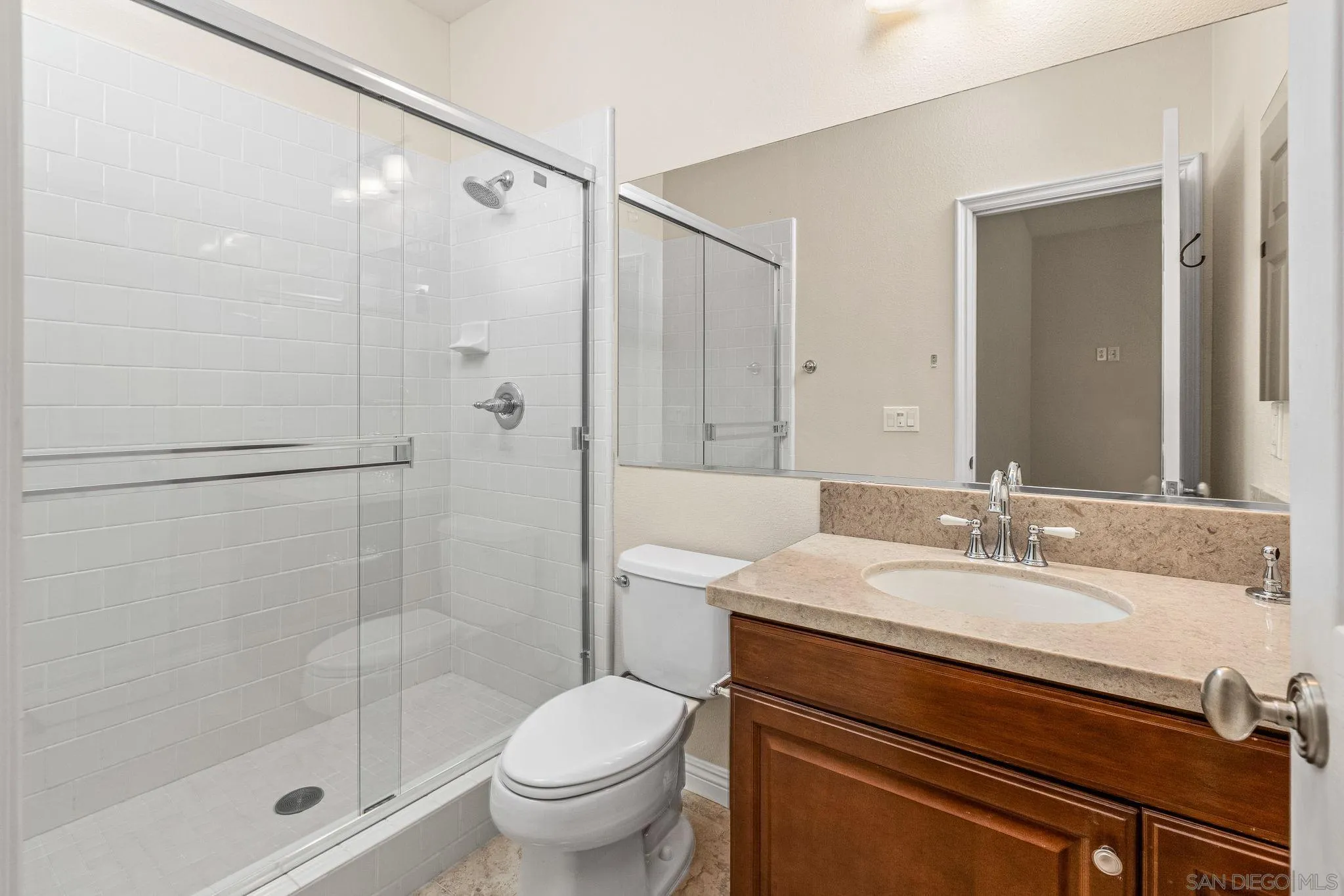 5582 Valerio Trail San Diego, CA 92130 - Photo 24 of 43 a bathroom with a sink a toilet and shower