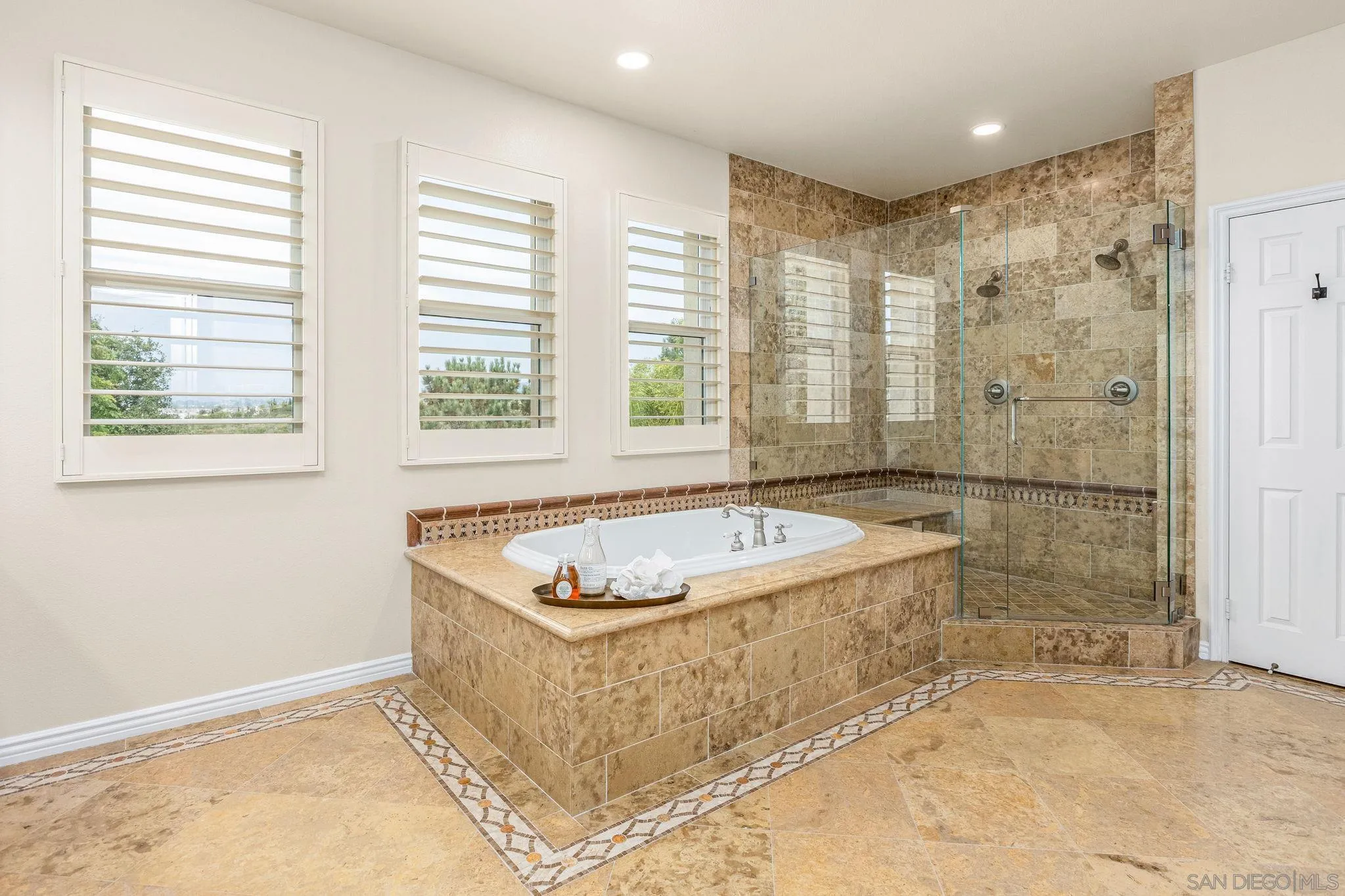 5582 Valerio Trail San Diego, CA 92130 - Photo 29 of 43 a view of bathroom with bathtub and shower