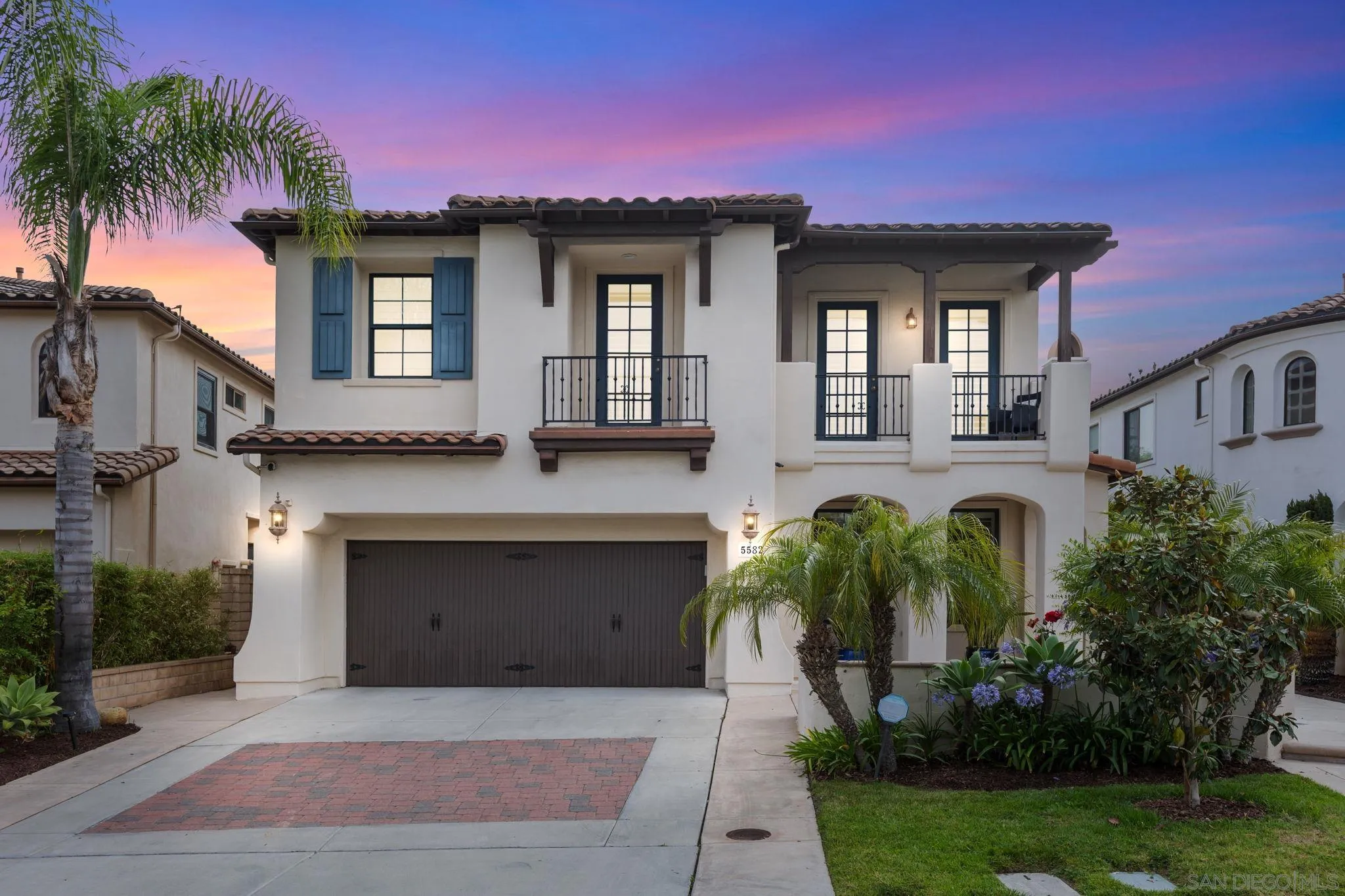 5582 Valerio Trail San Diego, CA 92130 - Photo 3 of 43 a front view of a house with garden