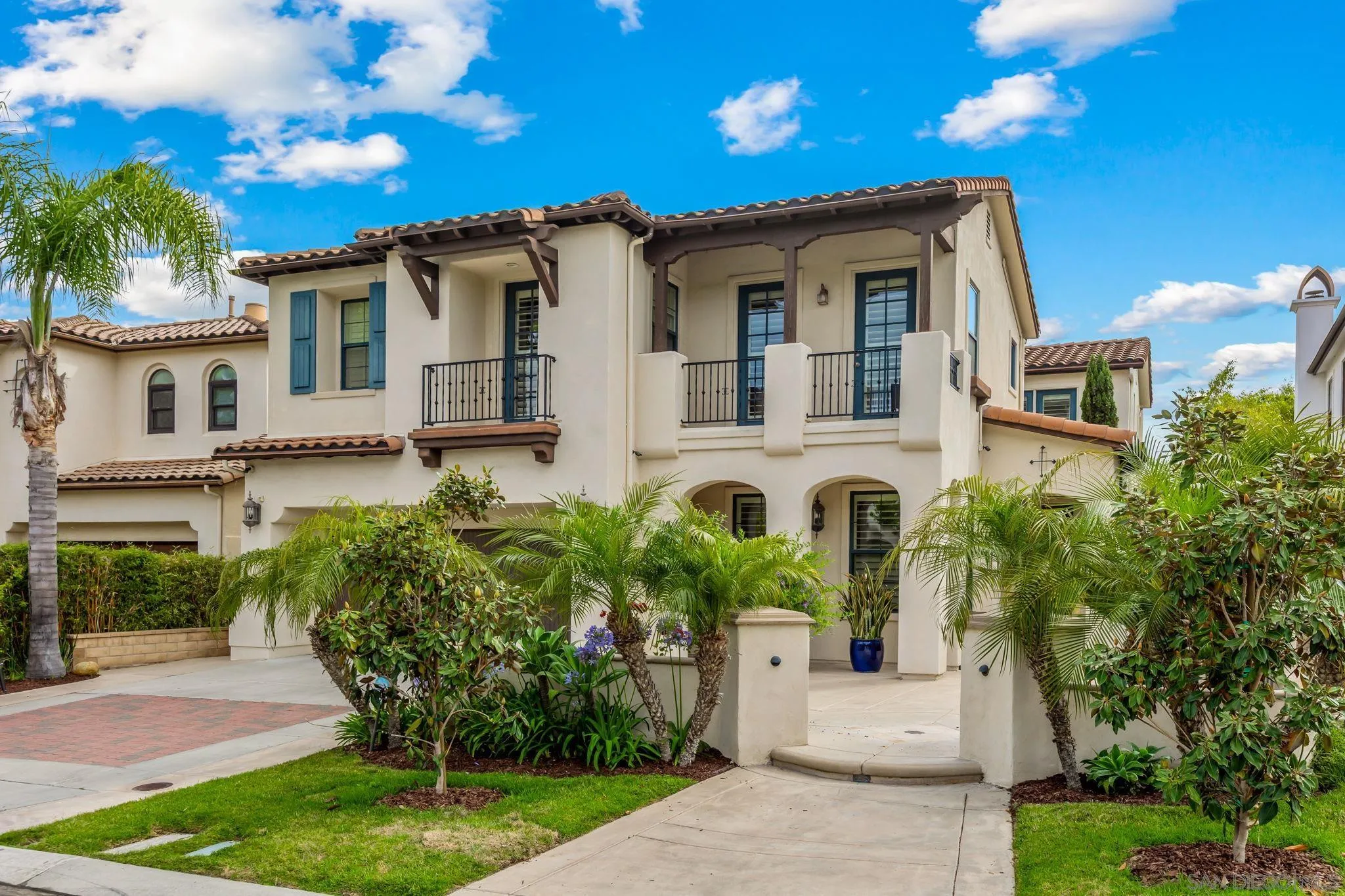 5582 Valerio Trail San Diego, CA 92130 - Photo 35 of 43 a front view of a house with a garden