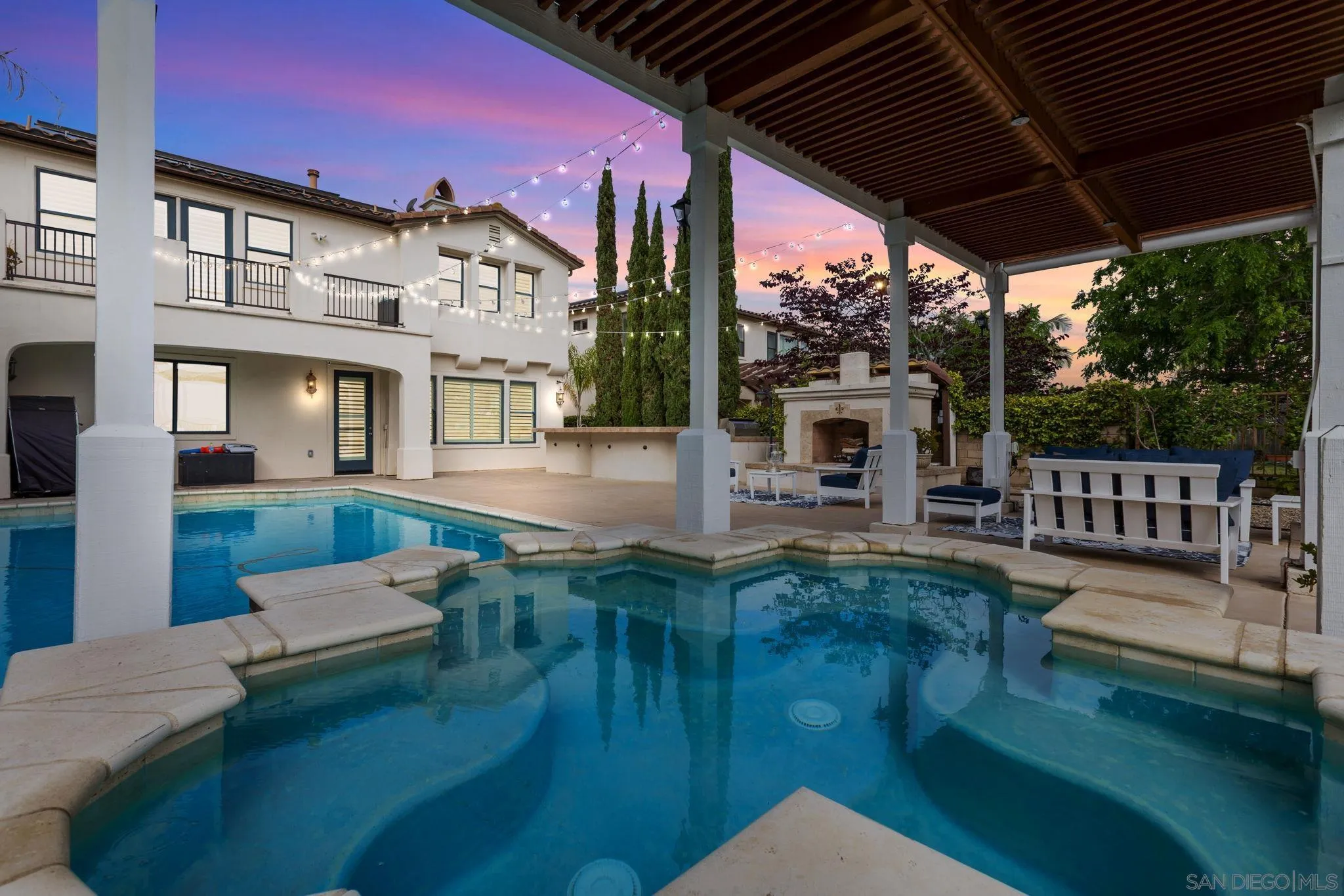 5582 Valerio Trail San Diego, CA 92130 - Photo 40 of 43 a view of a house with backyard outdoor seating and hardwood