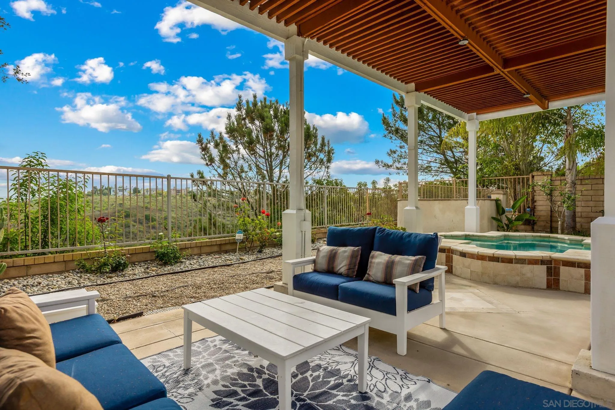5582 Valerio Trail San Diego, CA 92130 - Photo 42 of 43 a outdoor living space with furniture and a potted plant