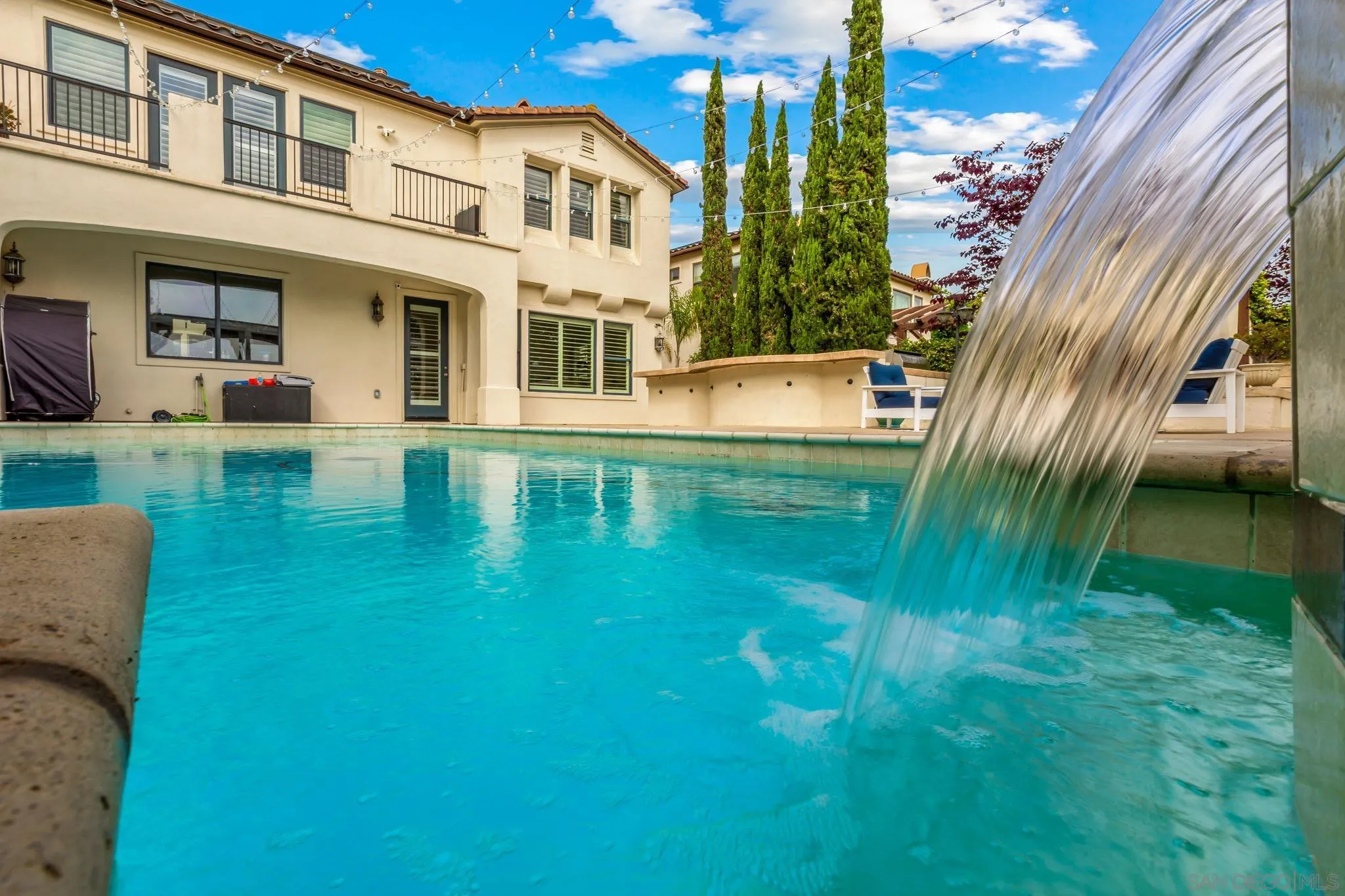 5582 Valerio Trail San Diego, CA 92130 - Photo 5 of 43 a view of a house with a swimming pool
