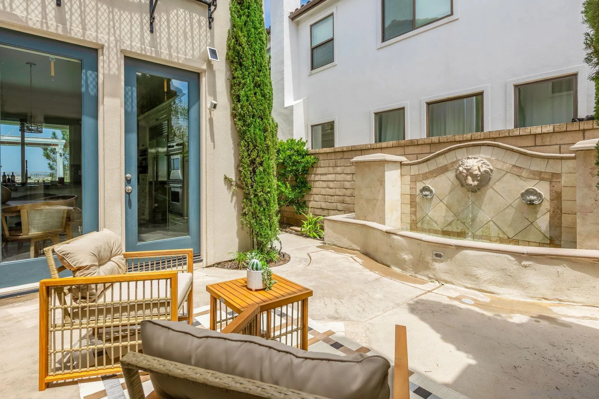 5582 Valerio Trail San Diego, CA 92130 - Photo 10 of 43 a view of a patio with couches table and chairs and potted plants