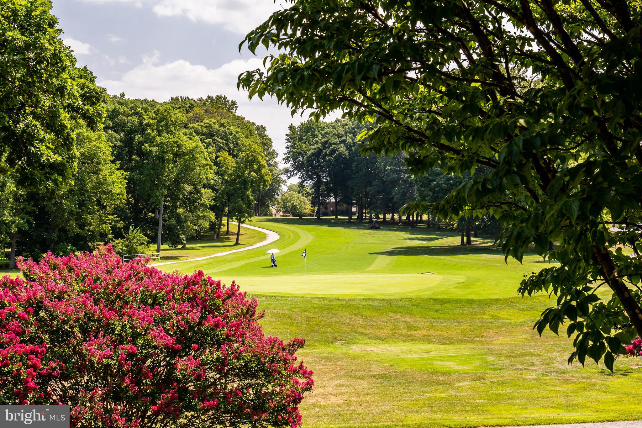 3110 Adderley Court, Unit 245A Silver Spring, MD 20906 - Photo 23 of 27 a view of a swimming pool with an outdoor space and seating area