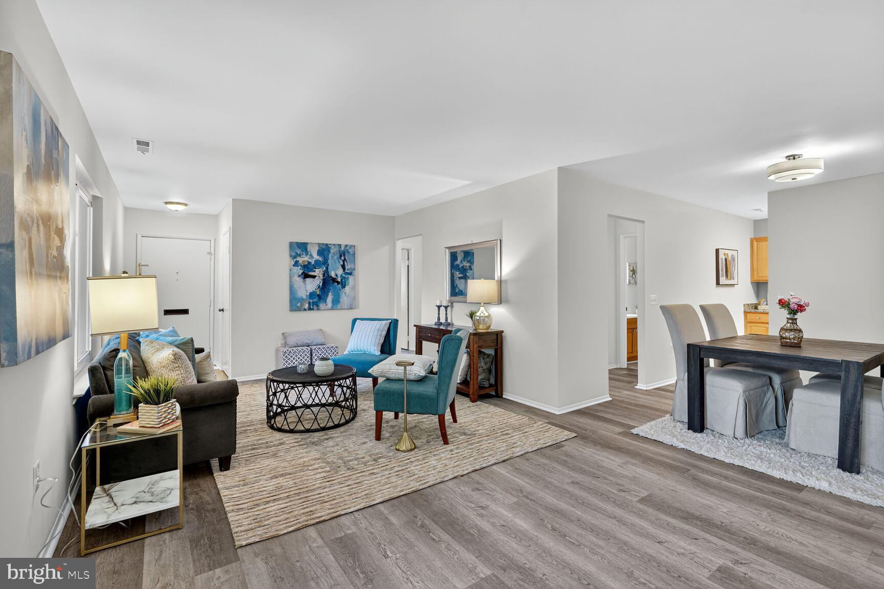 3110 Adderley Court, Unit 245A Silver Spring, MD 20906 - Photo 6 of 27 a living room with furniture and wooden floor