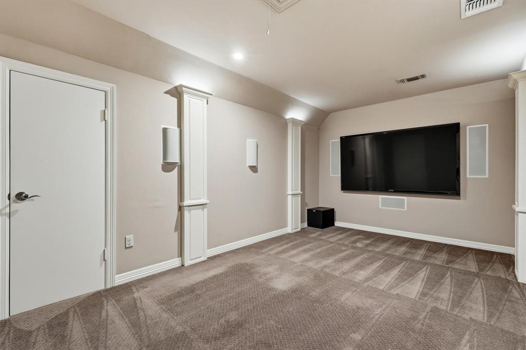 970 Crystal Cove Oak Point, TX 75068 - Photo 25 of 40 a view of an empty room with wooden floor and a bathroom