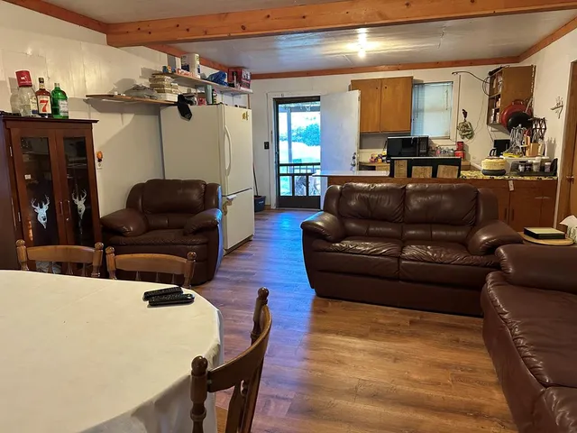 a view of open space with yard