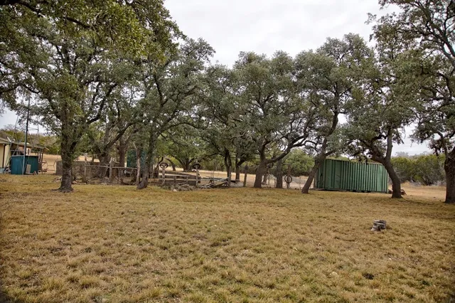 an aerial view of residential houses with city view
