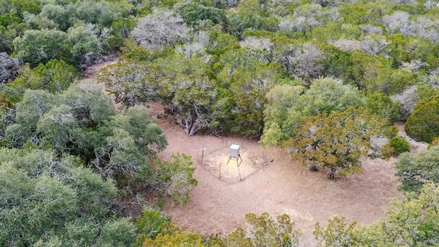an aerial view of a house with yard and outdoor space