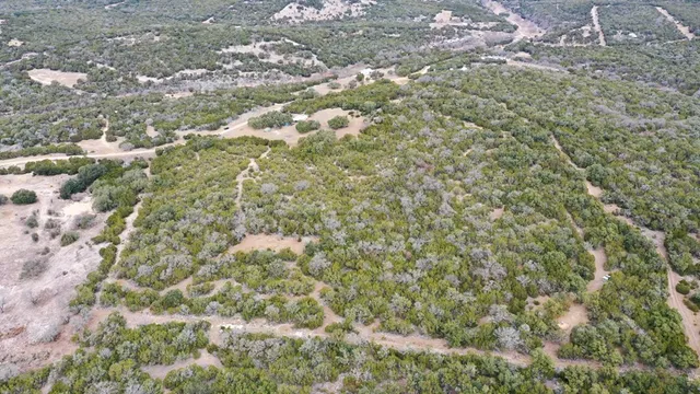 an aerial view of residential house with outdoor space