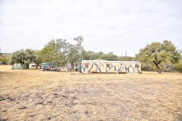 an aerial view of residential houses with city view
