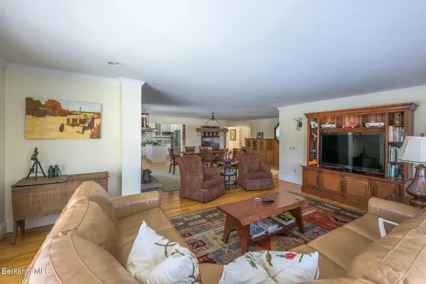 a en suite bathroom with a granite countertop sink and a mirror