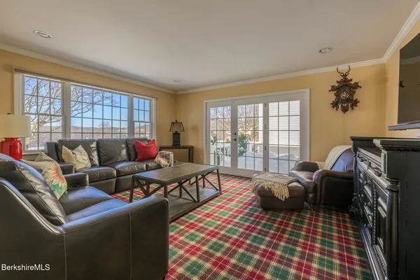 a bedroom with furniture and a window