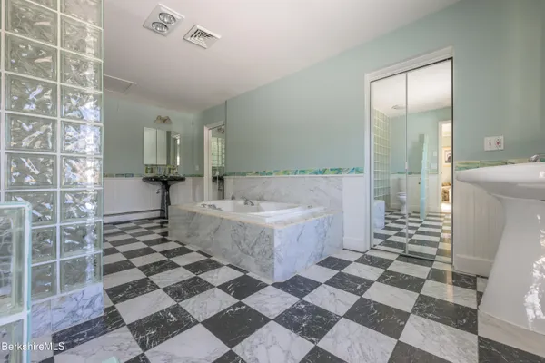a bathroom with a glass door shower