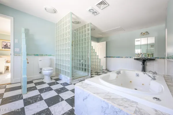 a living room with furniture pool table and sofas
