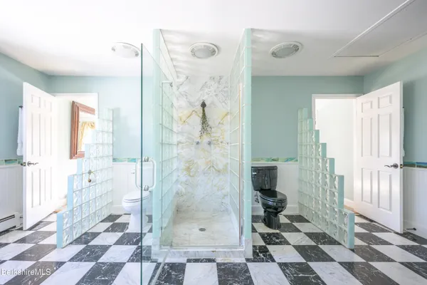 a view of a patio with table and chairs