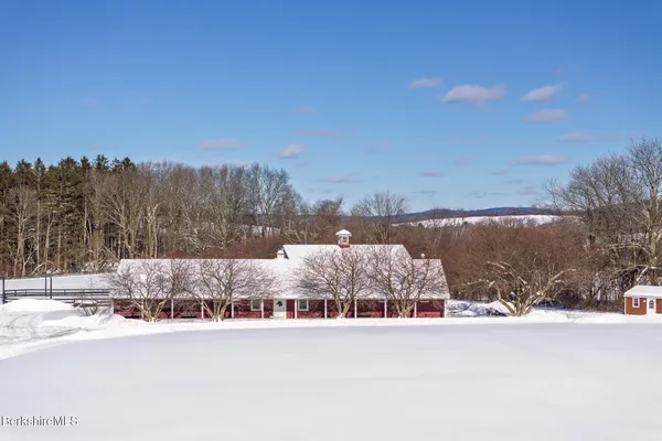 a view of snow on the side of the road