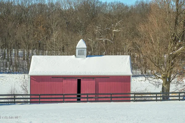 a terrace with a bench and mountain view