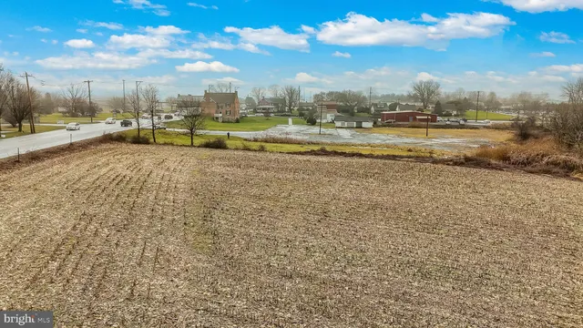 a view of a swimming pool with an outdoor space and seating area