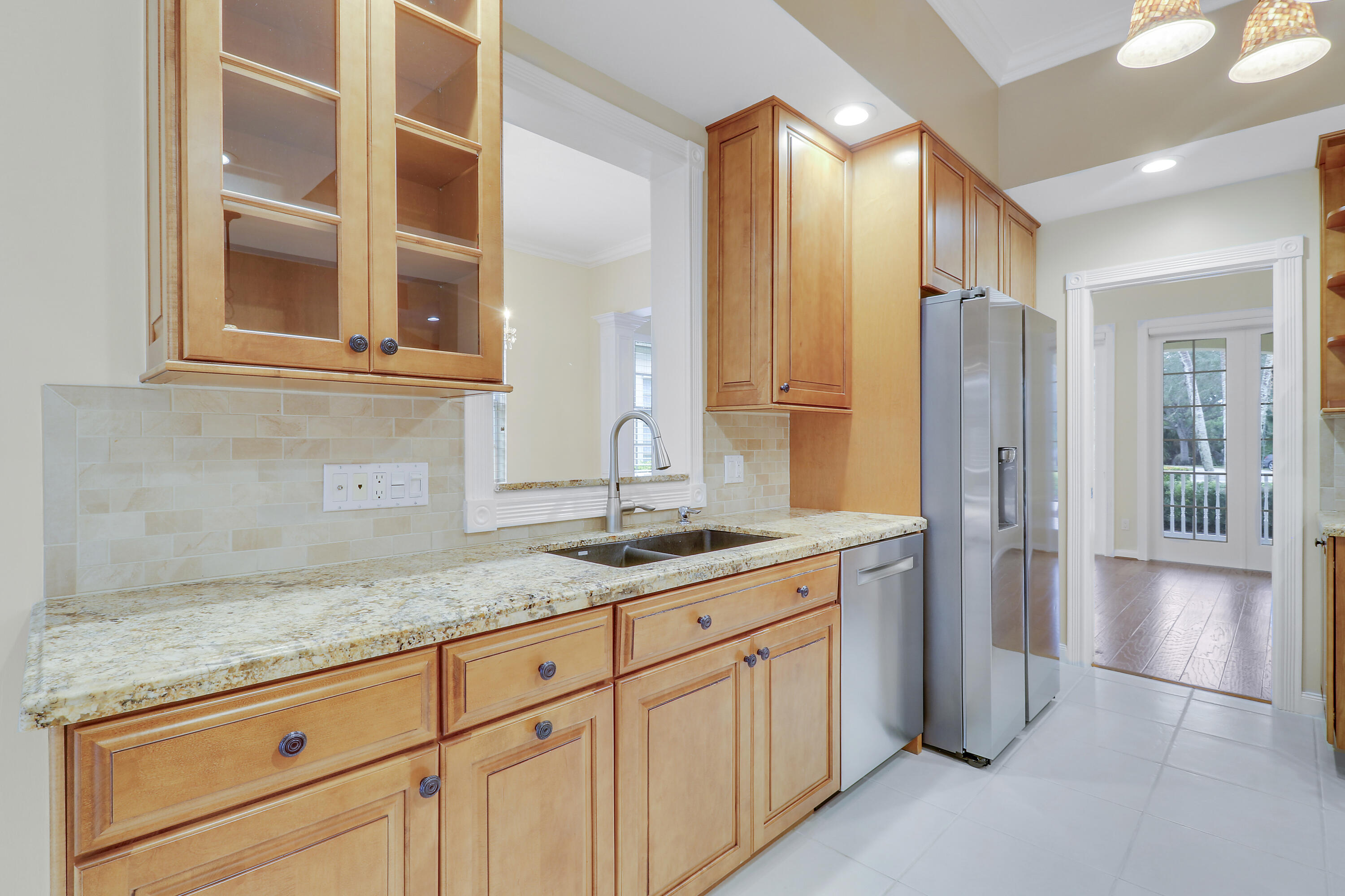 8657 Southeast Nicolete Lane Hobe Sound, FL 33455 - Photo 15 of 50 a bathroom with a granite countertop sink and a mirror
