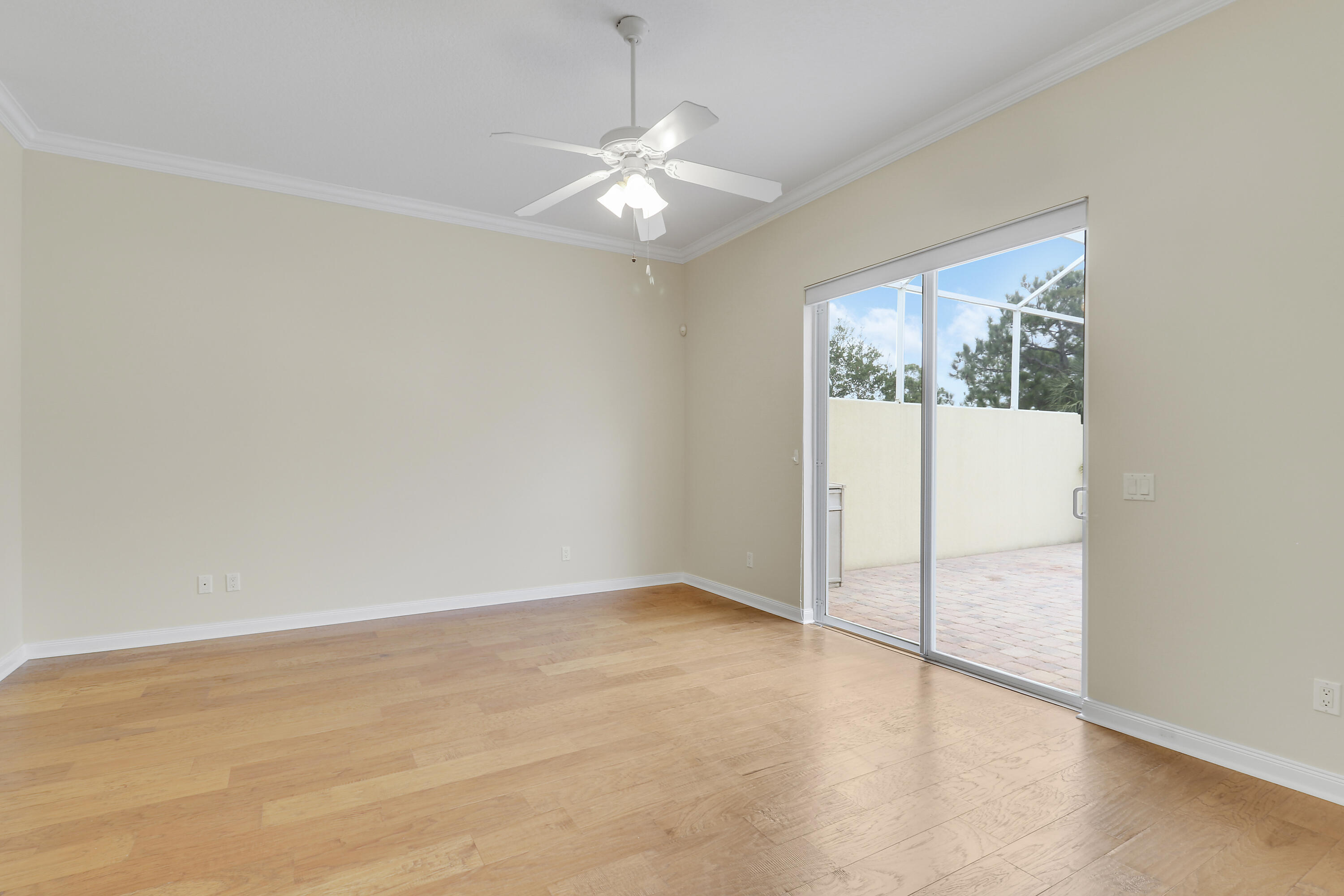 8657 Southeast Nicolete Lane Hobe Sound, FL 33455 - Photo 24 of 50 an empty room with fan and windows