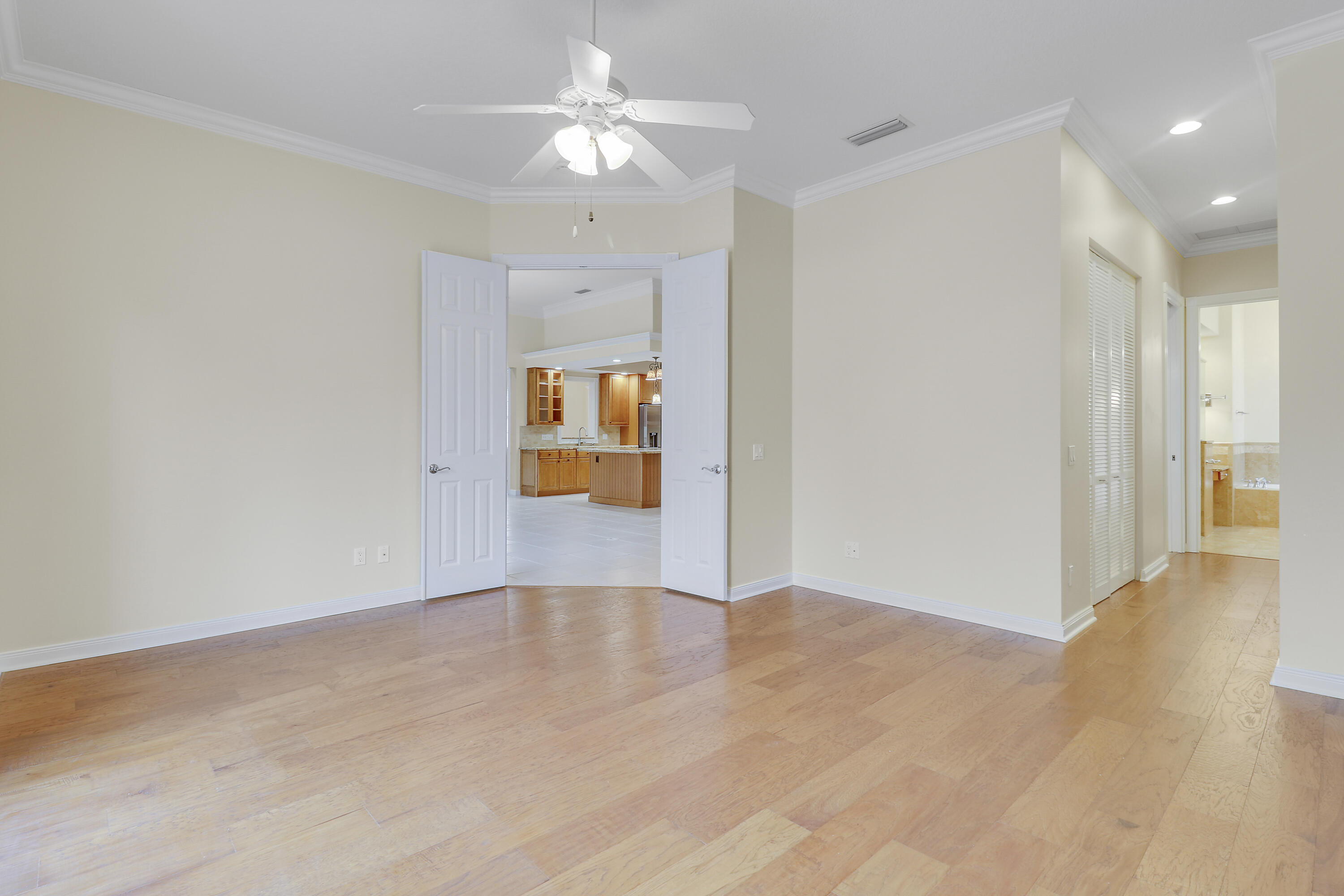 8657 Southeast Nicolete Lane Hobe Sound, FL 33455 - Photo 25 of 50 wooden floor in an empty room with a window