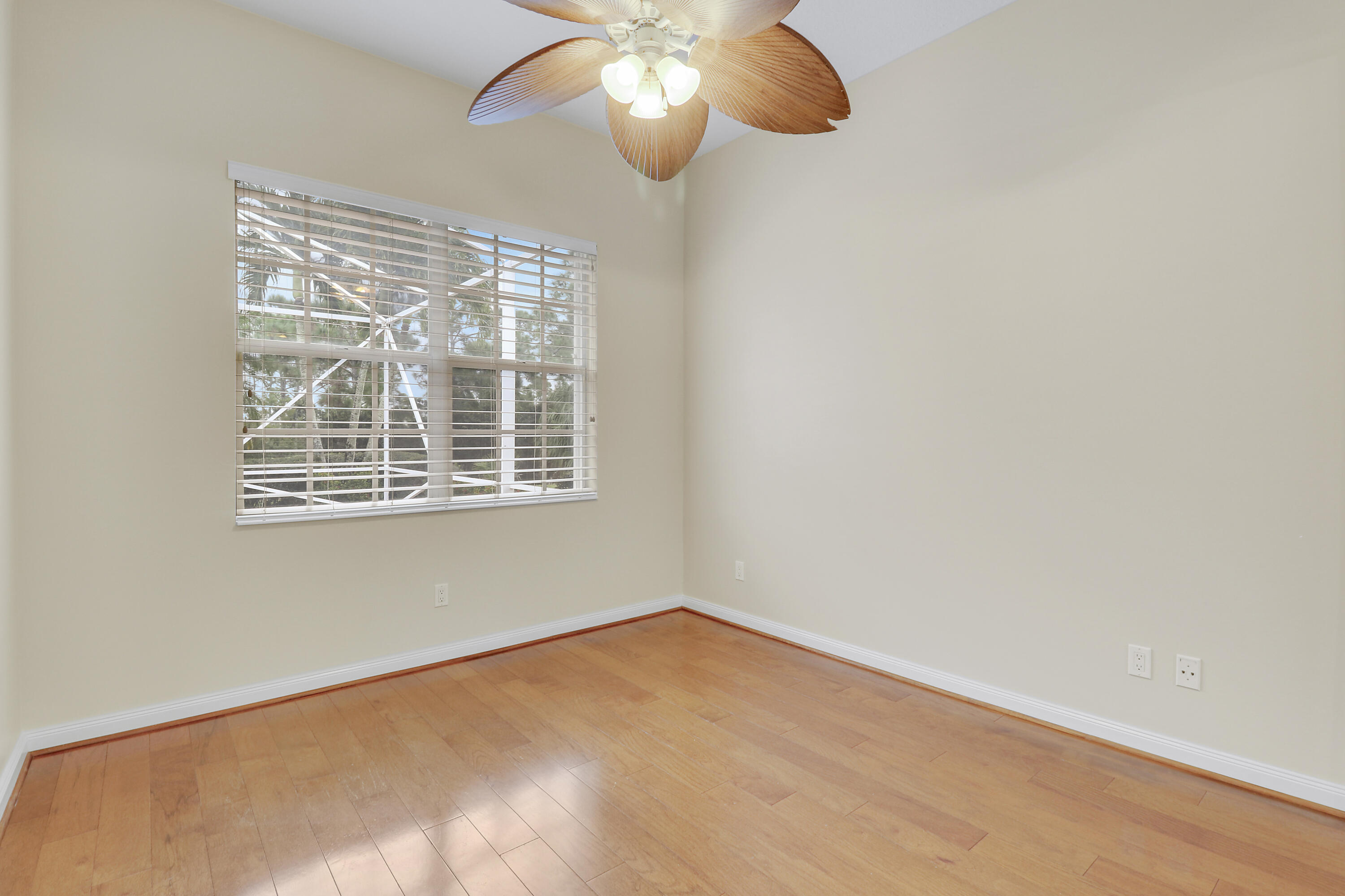 8657 Southeast Nicolete Lane Hobe Sound, FL 33455 - Photo 32 of 50 a view of an empty room with a window