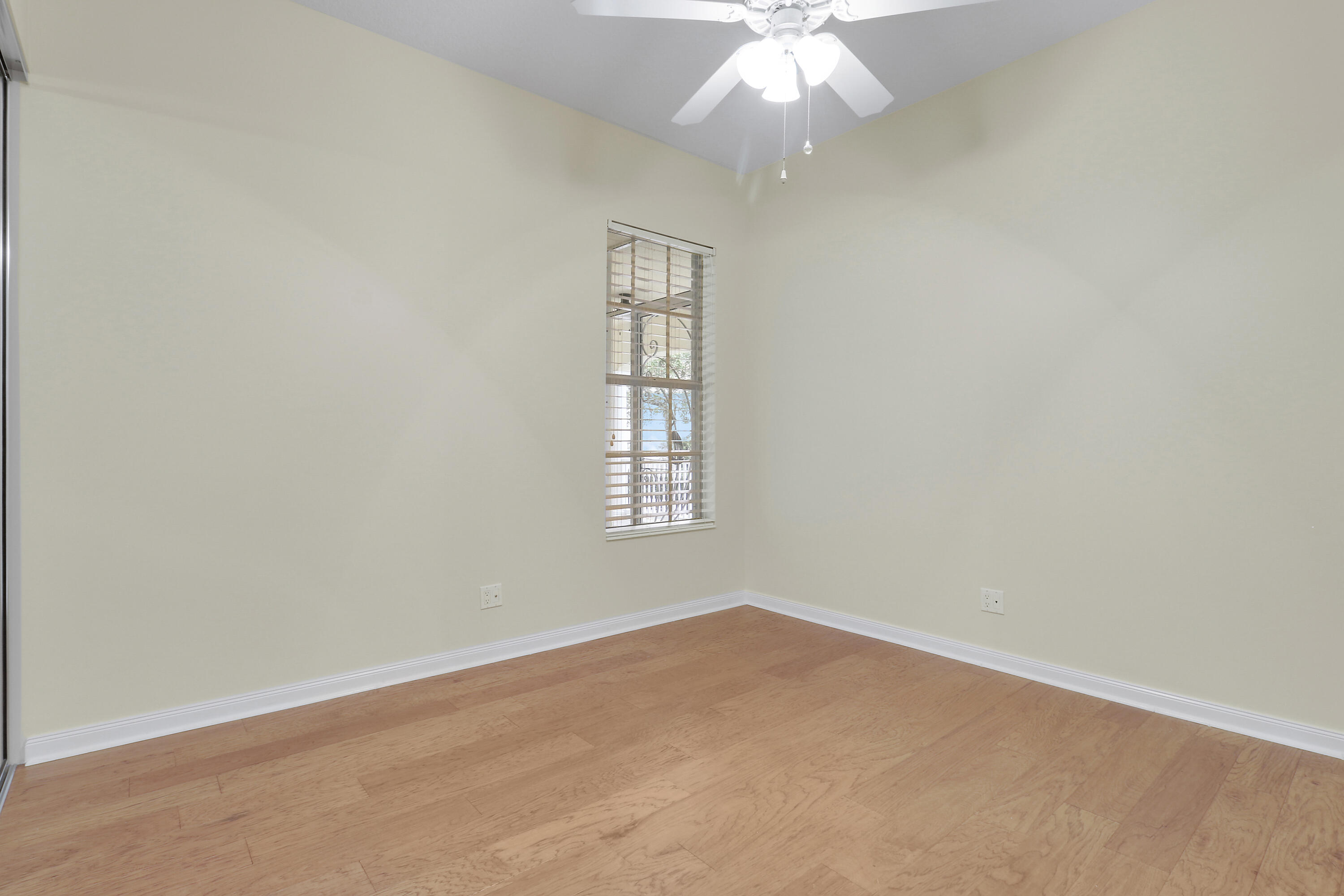 8657 Southeast Nicolete Lane Hobe Sound, FL 33455 - Photo 34 of 50 an empty room with a window