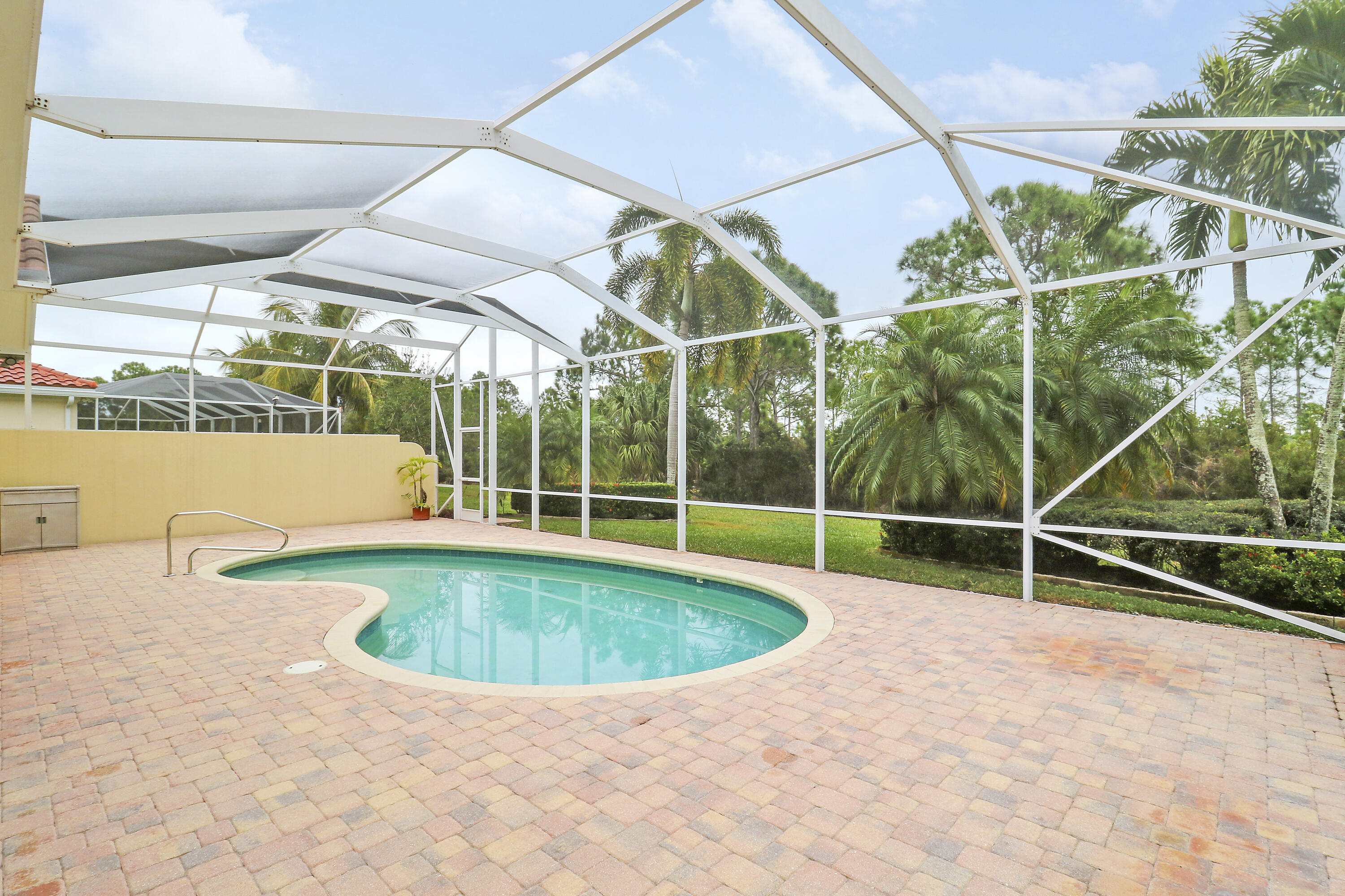 8657 Southeast Nicolete Lane Hobe Sound, FL 33455 - Photo 41 of 50 a view of outdoor space with swimming pool