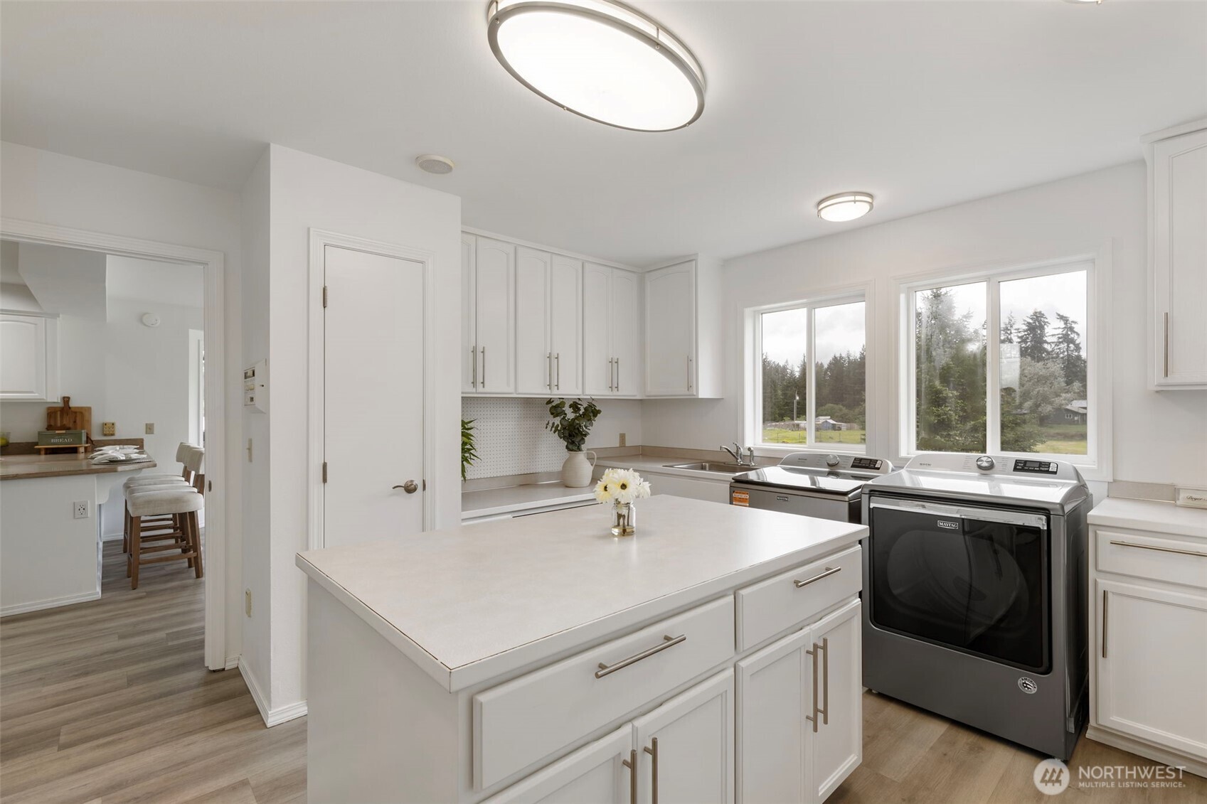 14110 Glenwood Road Southwest Port Orchard, WA 98367 - Photo 16 of 40 a kitchen with a sink stove and cabinets
