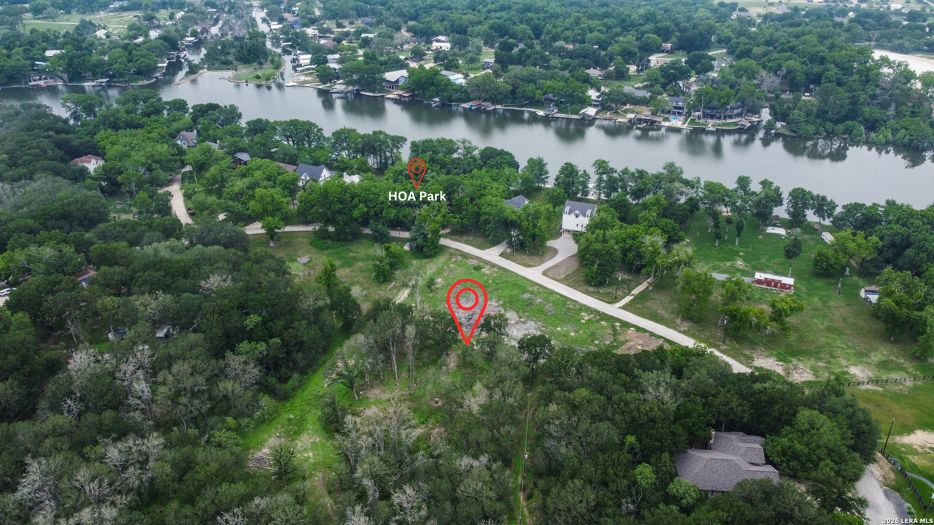 Tbd Chickasaw Centre Seguin, TX 78155 - Photo 3 of 15 a view of a lake with a lake and a yard