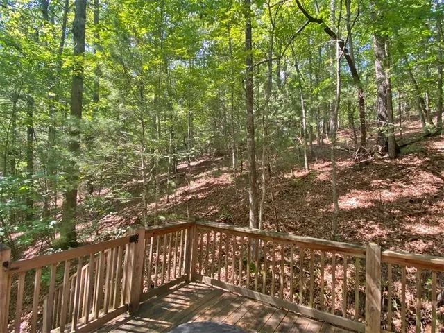 a view of mountain with wooden fence