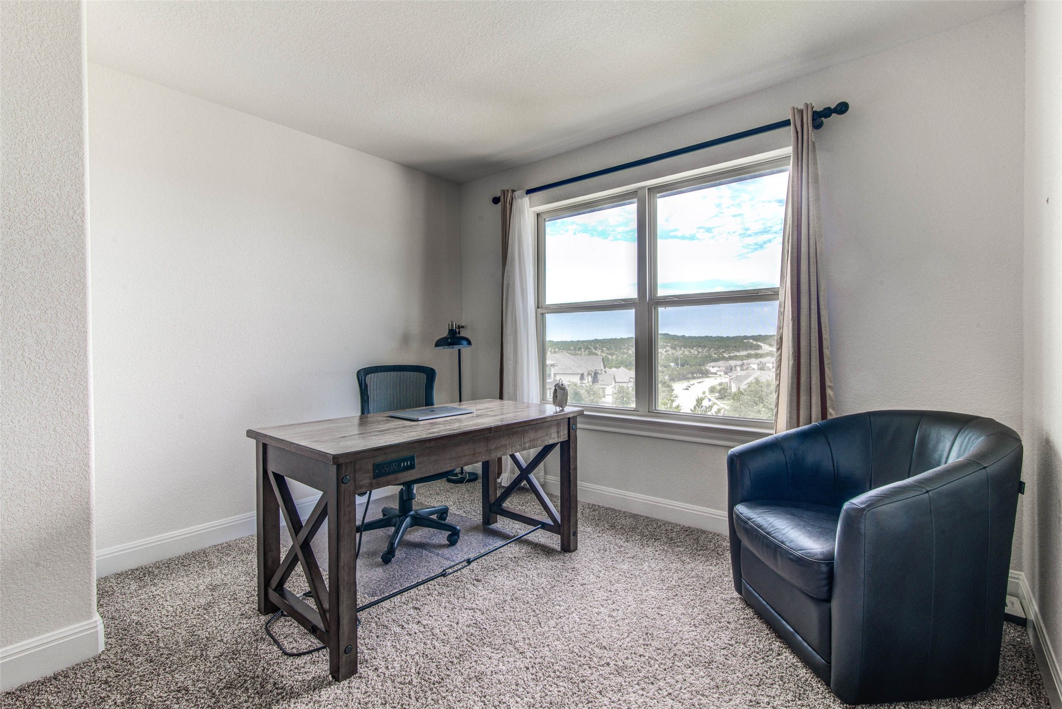 15621 Cabrillo Way Austin, TX 78738 - Photo 17 of 21 a living room with furniture and a window